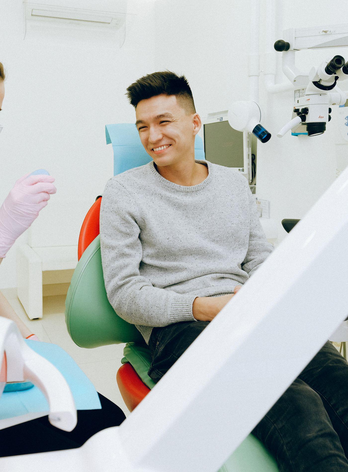 Dental professional with a happy patient